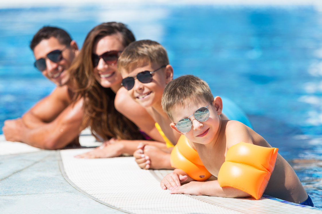 family enjoying the swimming pool